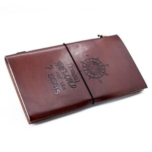 Handmade brown leather journal with embossed design and wrap-around band.