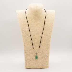 Jade turtle pendant on an adjustable cord, showcasing its earthy green tones.