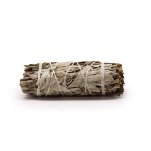 Natural smudge stick made with white sage and pirul foliage for cleansing rituals.