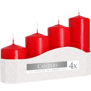 Set of four red pillar candles in various heights for a warm ambiance.