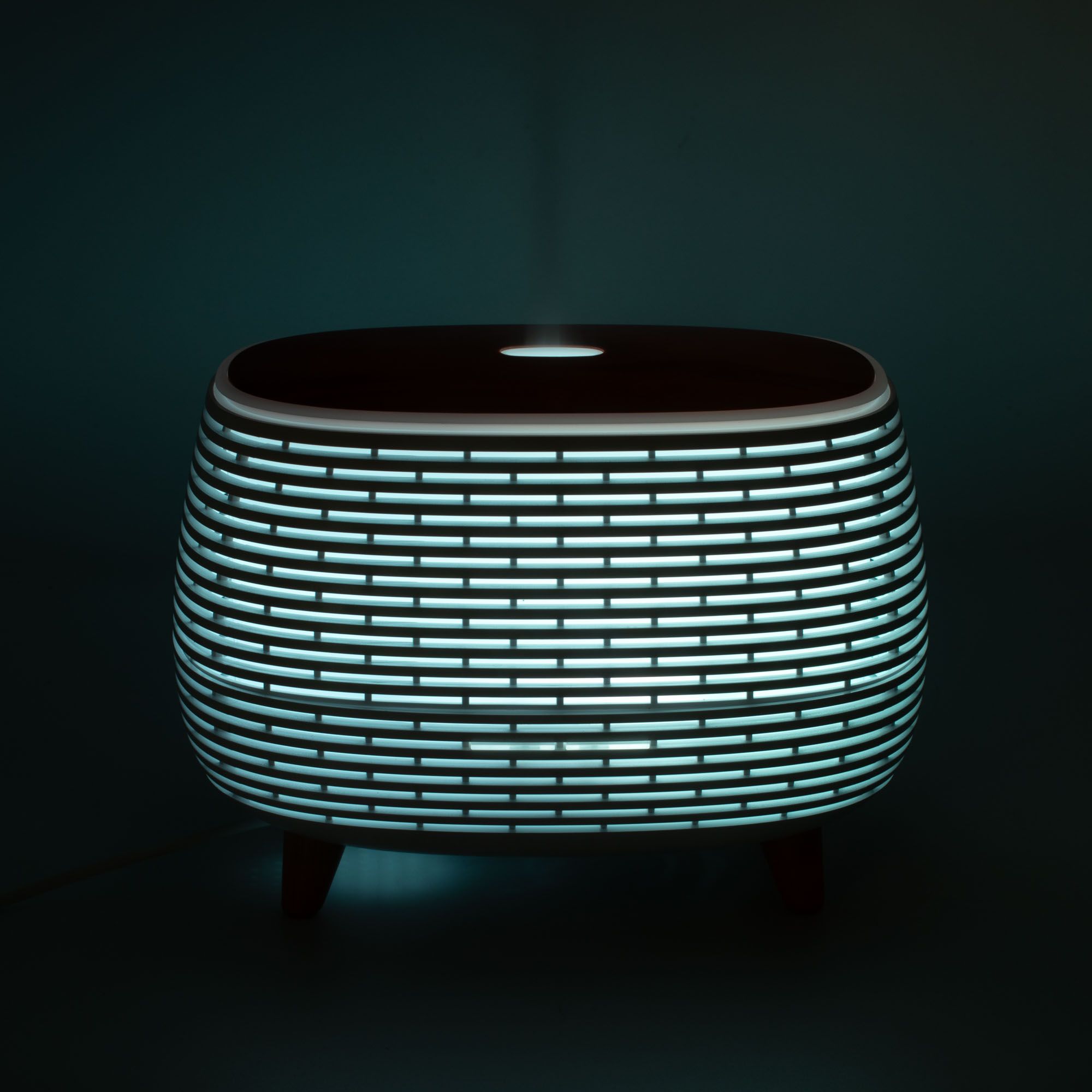 Futuristic ribbed aroma diffuser with wood-effect top and colour-changing light.