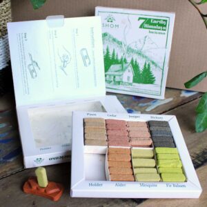 Display set of 70 incense smudge bricks with terracotta burner for calming aromas.