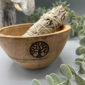 Wooden smudge bowl with Tree of Life design, perfect for rituals and offerings.