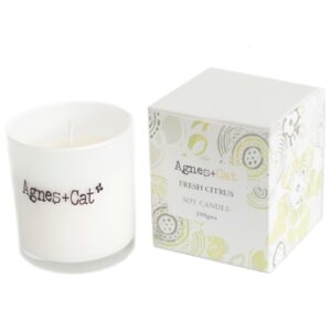 Votive candle with a fresh citrus scent, perfect for uplifting any space.