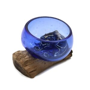 Handcrafted blue molten glass bowl on a wooden base, perfect for home decor.