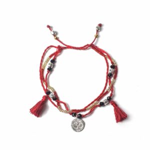 Temple String Bracelet featuring intricate silver beads and a symbolic charm.