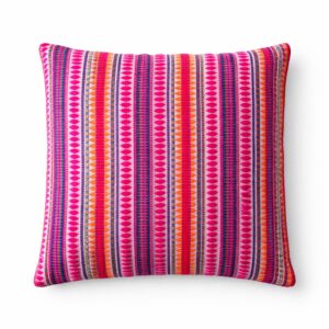 Vibrant neon striped cushion cover adding colour to a living space.