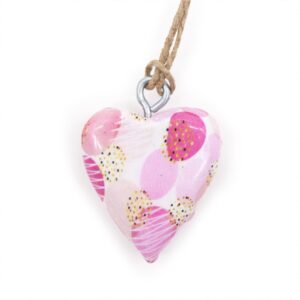 Decorative wood heart in pink abstract design for home decor.