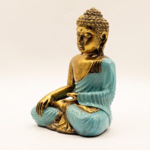 Large teal and gold Buddha statue in a classic Varada Mudra pose.