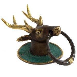 Elegant brass door knocker featuring a stags head design for welcoming guests.