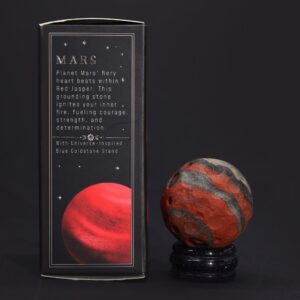 Red Jasper planet on a goldstone stand, symbolising strength and passion.