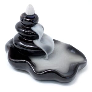 Large backflow incense burner with pebbles creating a cascading smoke effect.