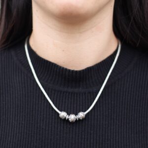 Elegant silver and gold necklace with a mystic design, perfect for gifting.