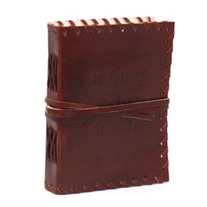 Leather-bound notebook with unique design and metal clasps, perfect for journaling.