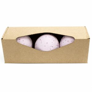 Set of three colourful bath bombs in a decorative arrangement.