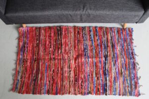 Handmade medium velvet rug in vibrant colours, perfect for any room.