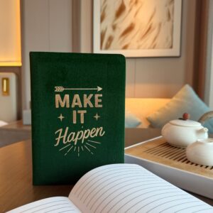Dark green velvet notebook with embossed silver lettering and motivational phrase.