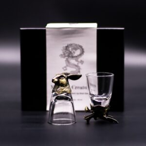 Set of six antique bronze shot glasses featuring mystical creature designs.