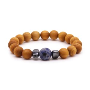 Cedarwood Throat Chakra Bangle with Sodalite gemstone on a neutral background