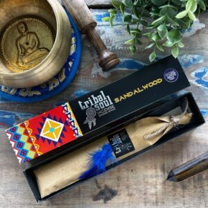 Tribal Soul incense sticks in a natural setting, featuring sandalwood scent.