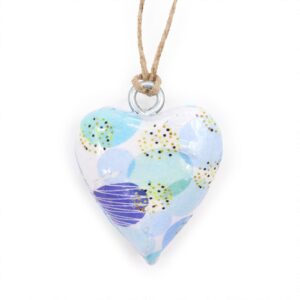 Small wooden heart decor with a blue abstract design for home styling.