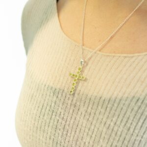Silver plated crucifix pendant with peridot-style stones on a 45cm chain.