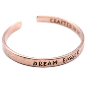 Handcrafted copper bracelet with inspirational messages from Nepal.