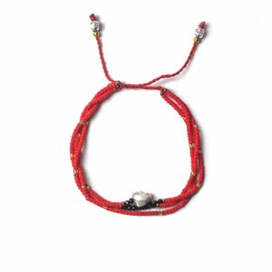 Handcrafted Temple String Bracelet featuring delicate beads and a silver heart.