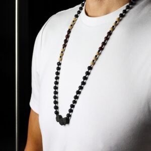 Handcrafted necklace made from natural lava stone, showcasing earthy tones and texture.