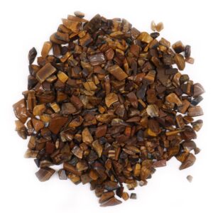 Bulk Tiger Eye gemstone chips in a natural setting, perfect for crafting and decoration.