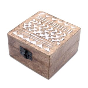 White washed wooden box featuring an intricate Aztec design.