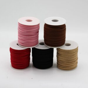 Dark brown faux suede pendant cord on a spool for crafting and jewellery making.
