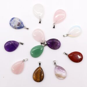Assorted gemstone teardrop pendants in various colours and patterns.