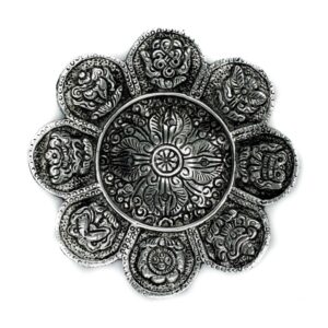Polished aluminium incense holder with Tibetan symbols, 12cm tall.