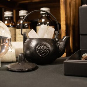 Small cast iron ritual pot featuring a pentagram design for focused energy.