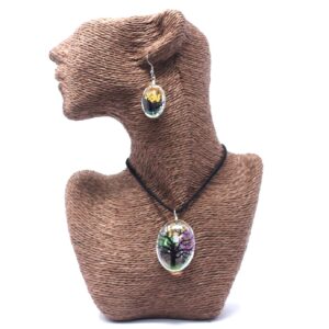 Unique jewellery featuring real pressed flowers in a glass pendant.