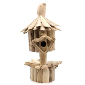 Handmade driftwood birdbox on stand, perfect for garden decor.