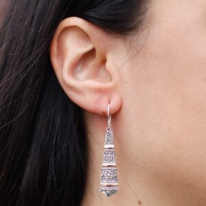 Elegant silver and gold tribal drop earrings with a hook fitting.