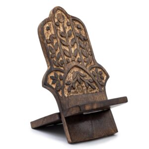 Hand-carved wooden phone stand featuring the Hamsa symbol for protection.