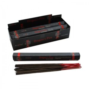 Dragon's Fire Incense Sticks in a decorative holder, emitting a calming aroma.