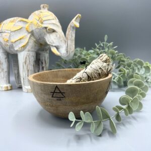 Wooden smudge bowl featuring four elemental designs for rituals and offerings.