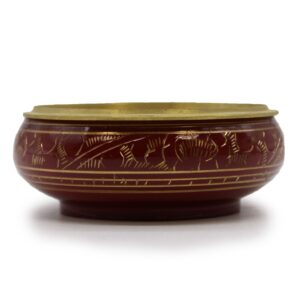 Handmade burgundy charcoal incense jar with golden patterns for rituals.