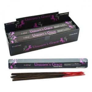 Unicorn's Grace Incense Sticks in a decorative holder, emitting a calming aroma.