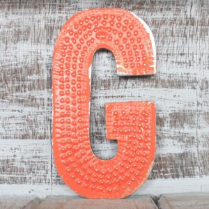 Multicoloured letter 'G' with a distressed finish, perfect for home decor.