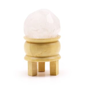 Rock Quartz gemstone faceted healing ball with a light brown wooden stand.