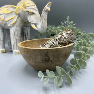Wooden smudge bowl featuring a Buddha design, perfect for rituals and offerings.