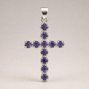 Silver plated Indian crucifix pendant with purple ionite stones.