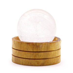 Clear quartz gemstone sphere with a stand, perfect for home decor.