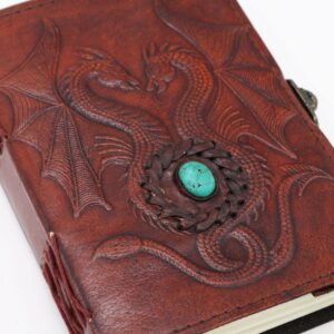 Antique grey esoteric notebook featuring two dragons on the cover.