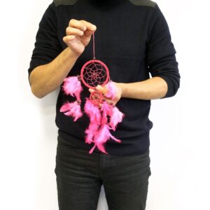 Medium round Bali dreamcatcher in turquoise, pink, and purple colours.